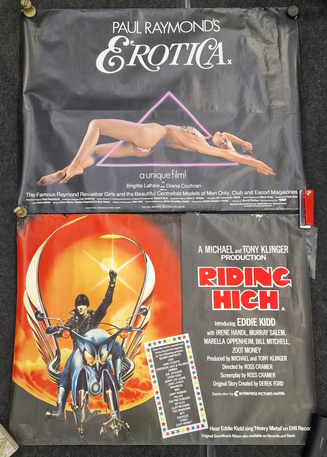 Two vintage rolled film posters to include "Paul Reymond's Erotica" and "Riding High" each 100x66cm.