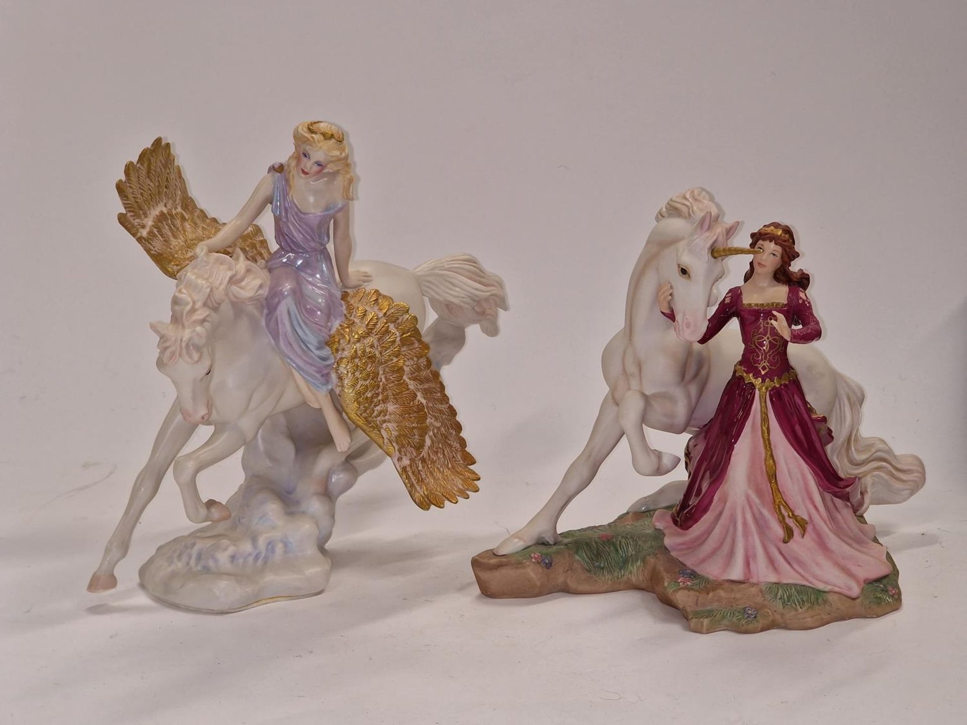 Two Franklin Mint porcelain figurines "The Lady and the Unicorn" and "Athene and Pegasus".