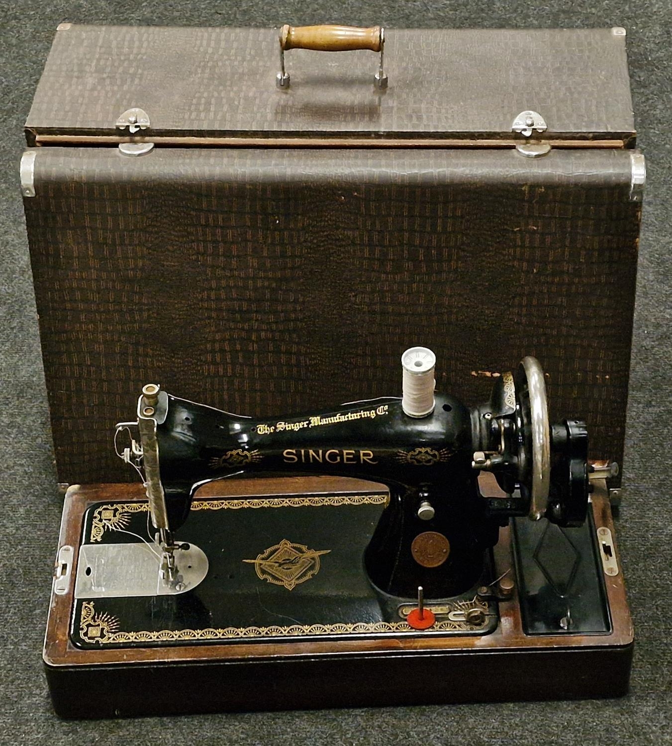 Vintage Singer sewing machine in original case.