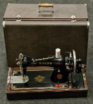 Vintage Singer sewing machine in original case.