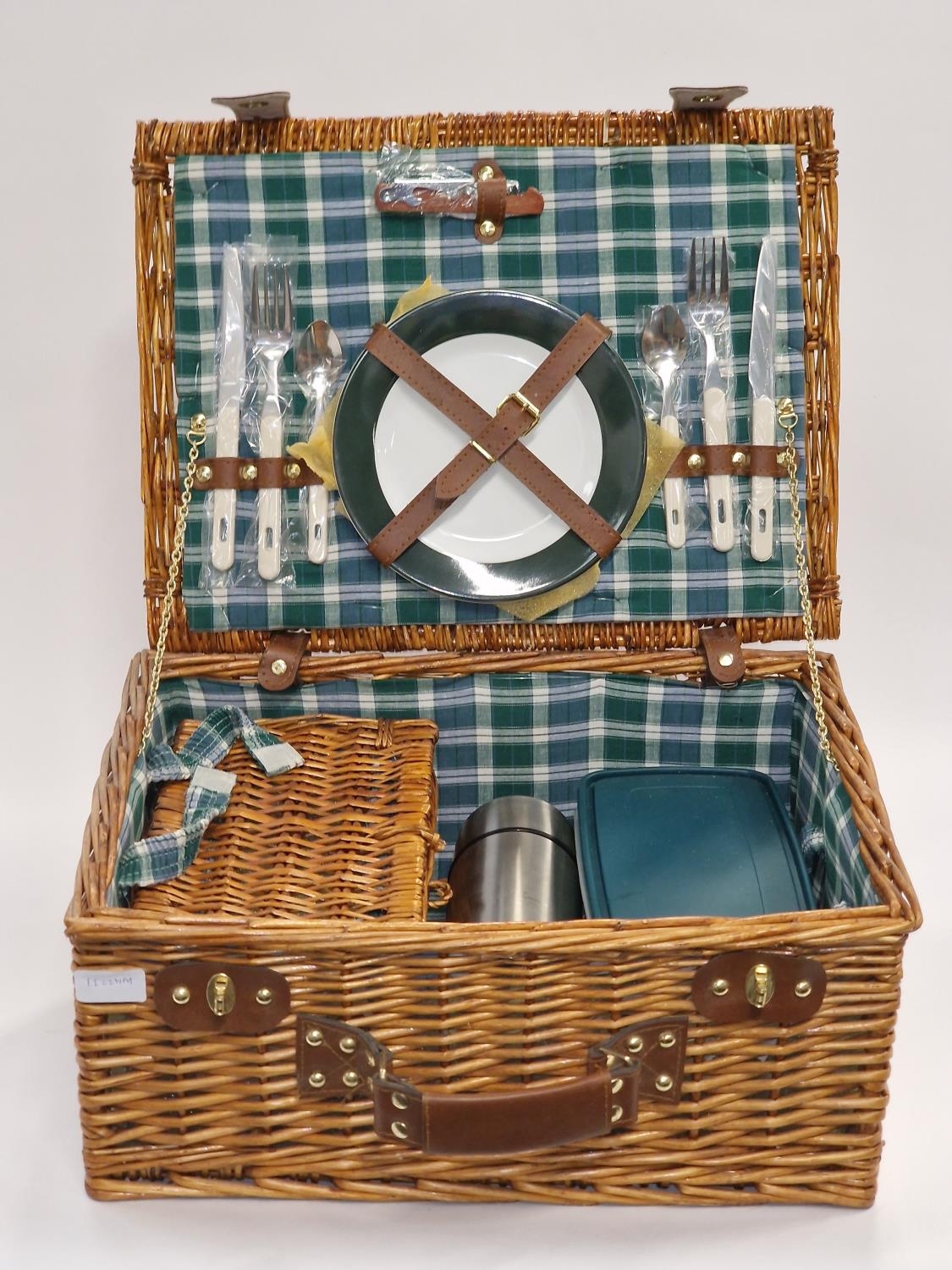 A vintage wicker complete picnic set for two looks unused.