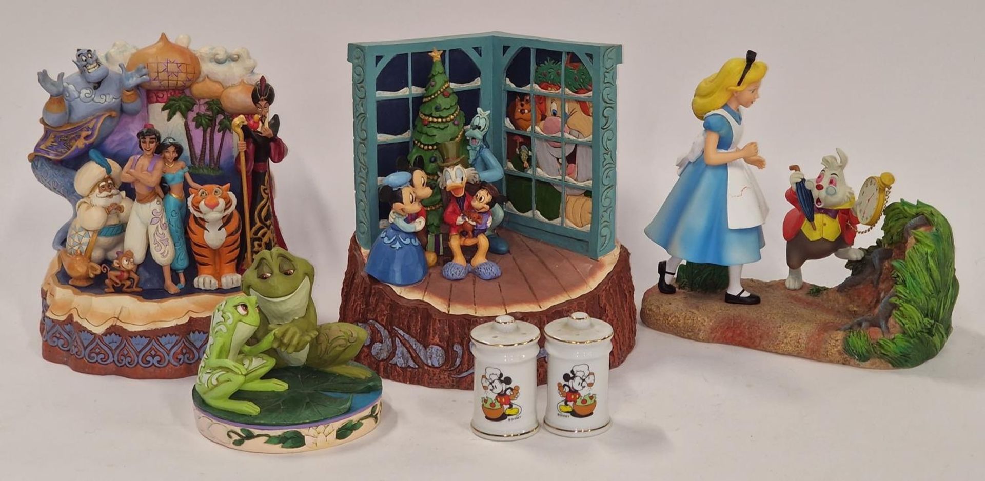 Collection of Enesco Disney figurines together with a pair of Disney salt and pepper pots.