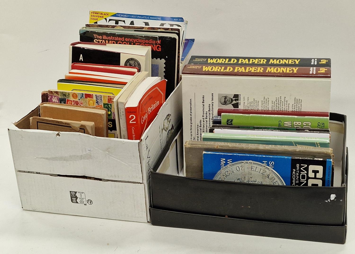 Two boxes of books relating to stamp and coin collecting together with some UFO and science