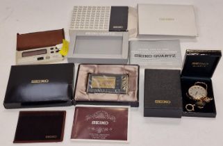 A collection of vintage Seiko digital travel alarm clocks together with another Seiko pocket