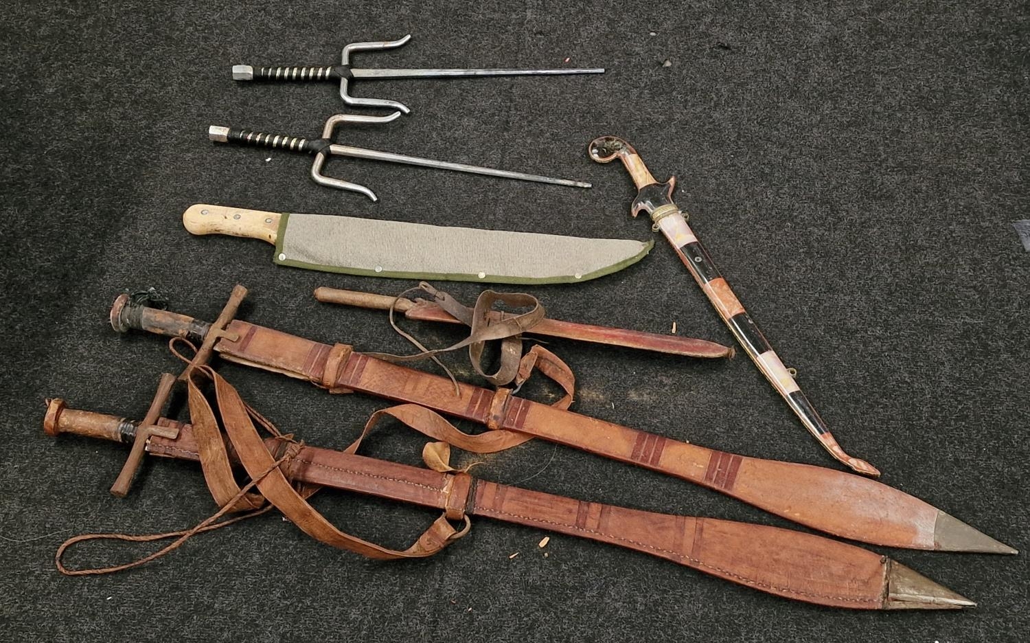 Collection of reproduction swords etc together with martial arts equipment.