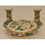 Miessen style floral twin handled pot pourri together with a pair of candlesticks.