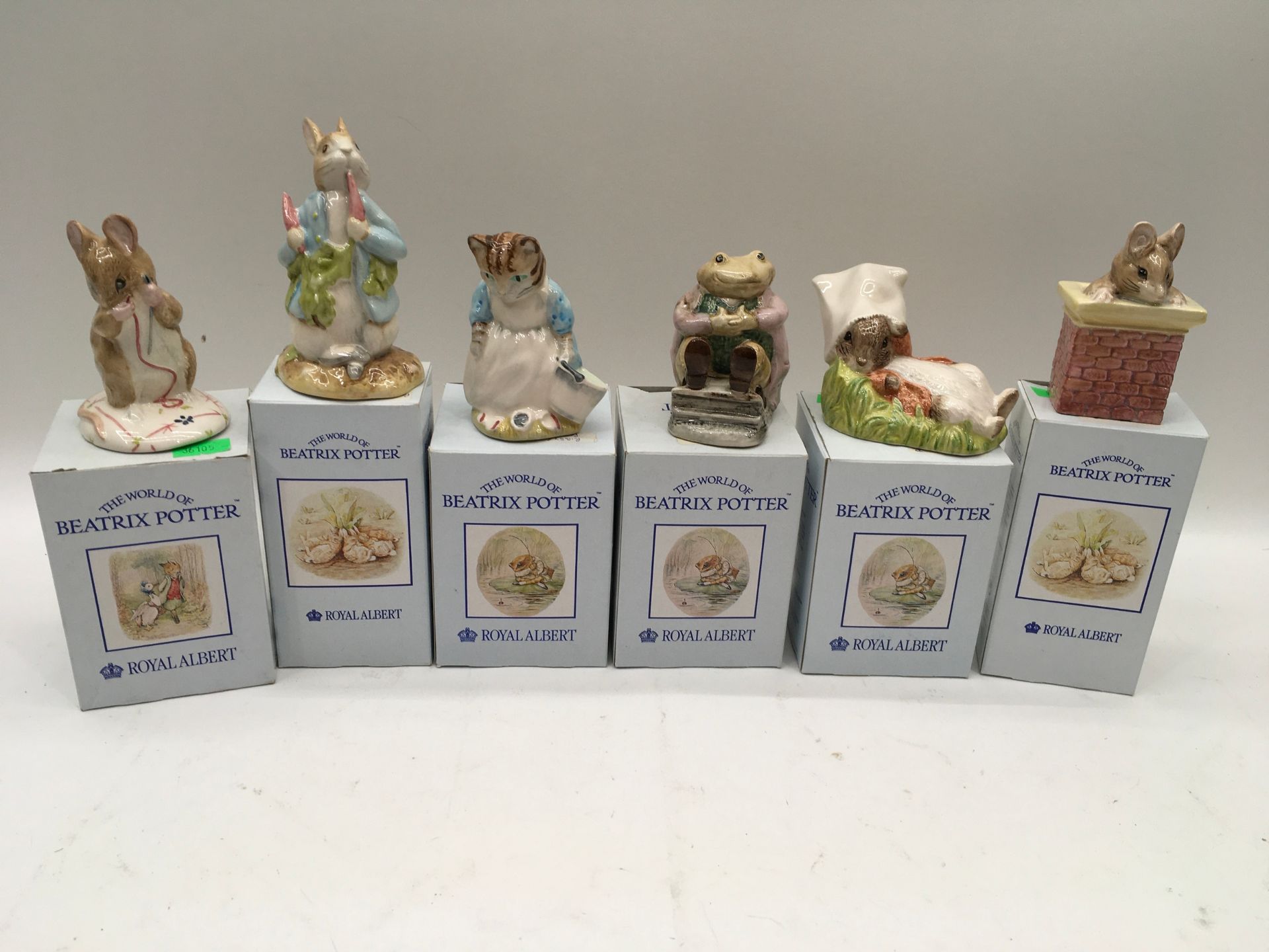 Six Royal Albert Beatrix Potter figures with boxes.
