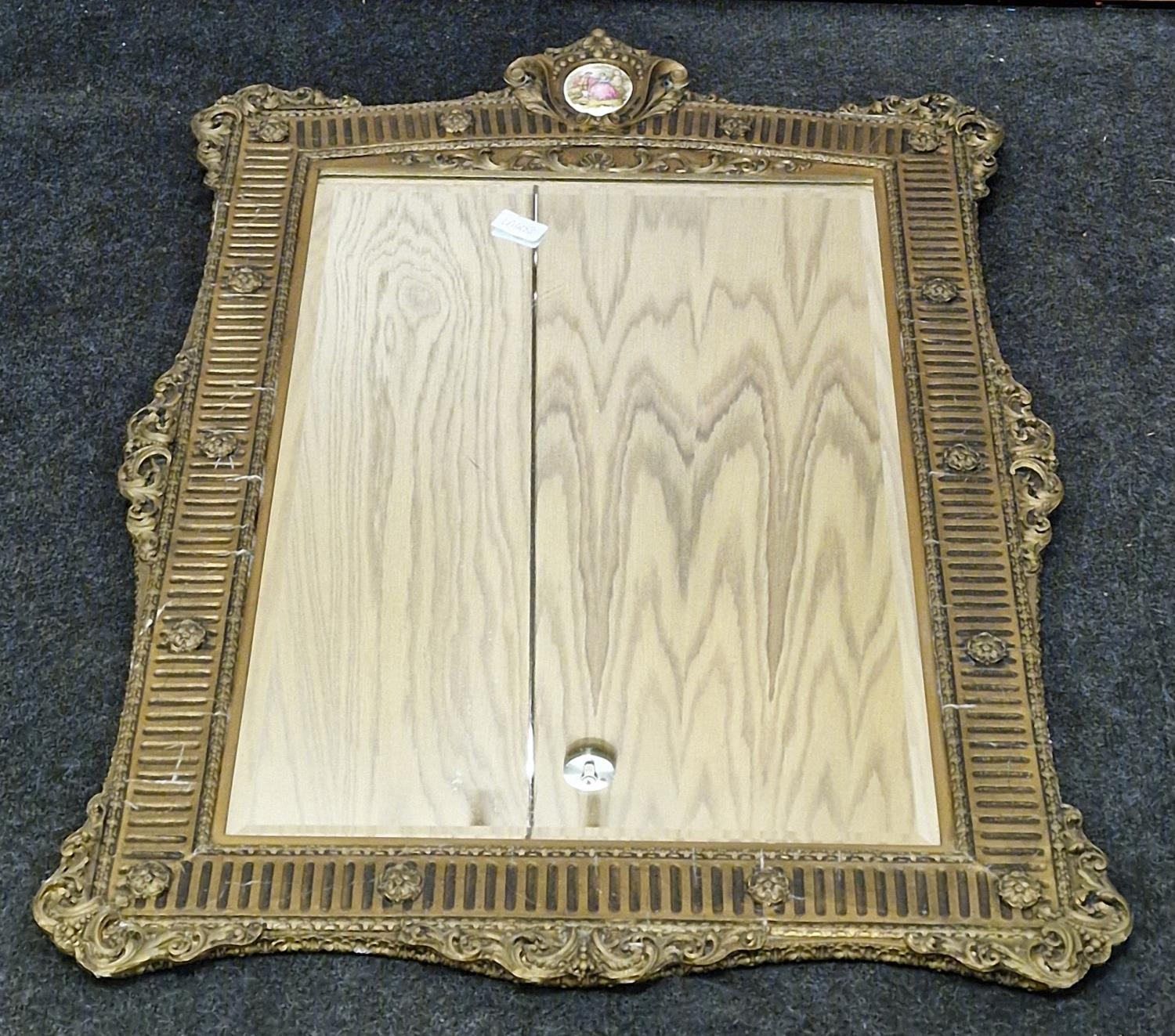 Vintage gilt framed wall mirror with bevelled edged glass and decorative pictorial plaque to top