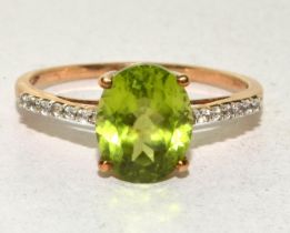9ct gold ladies large center Peridot and side Diamond ring size T