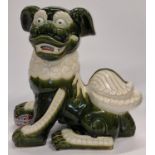 A vintage ceramic dog of fo figurine 45cm tall.