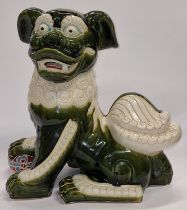 A vintage ceramic dog of fo figurine 45cm tall.