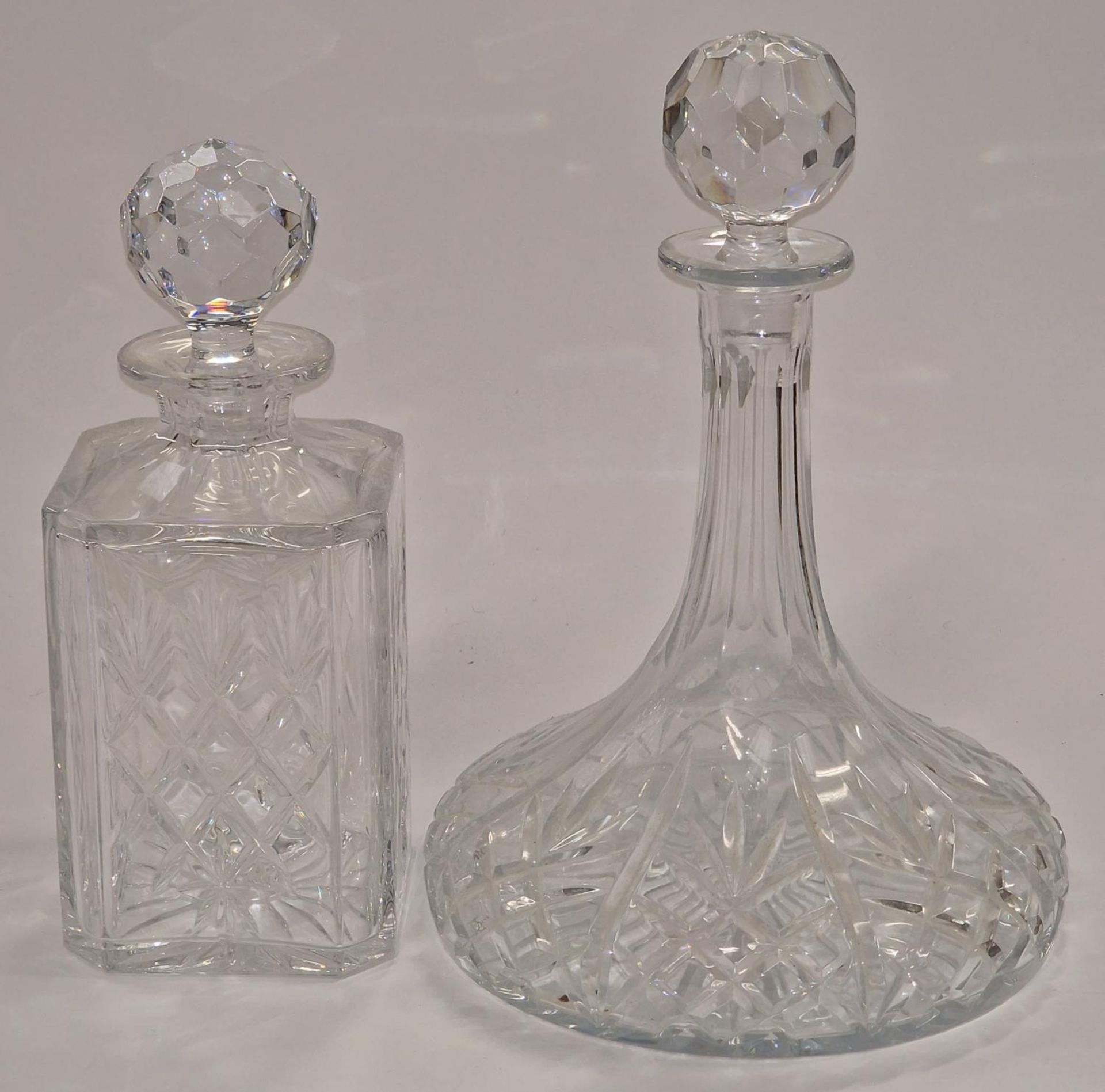 Two crystal glass decanters.
