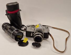 Nikon Nikkorex F vintage camera together with a Vivitar cased lens.