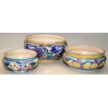 Three early 20thC Poole Pottery bowls in traditional patterns. Largest bowl (with a number of