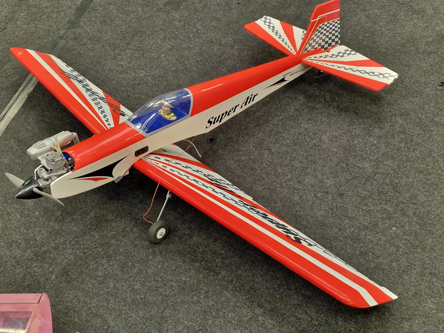 Two radio controlled airplanes both with engines. One controller and other accessories included. - Image 2 of 4