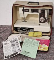 Vintage Jones electric sewing machine in carry case with accessories and paperwork.