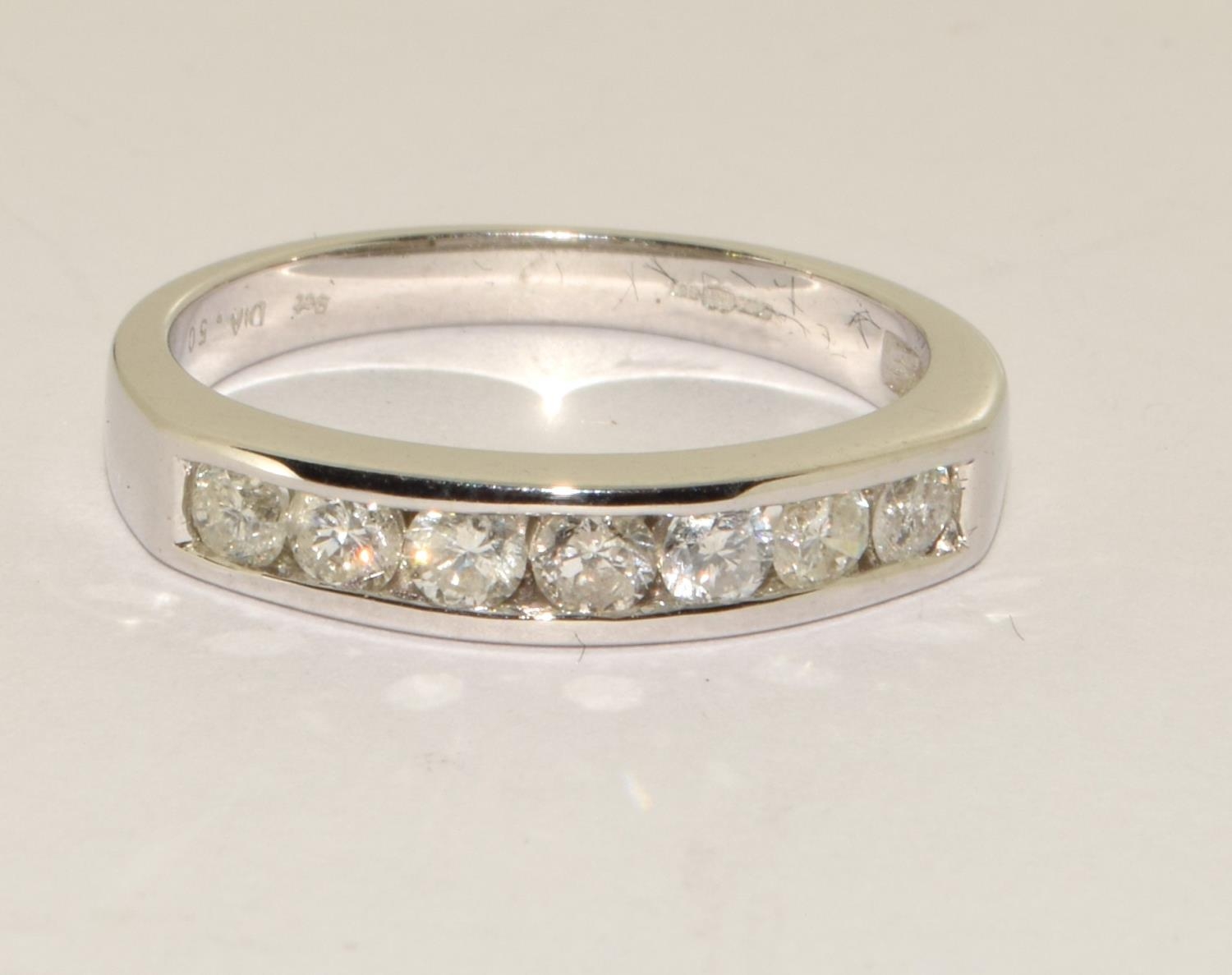 Diamond 0.50 point half eternity ring in 9ct white gold unworn size M+