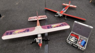 Two radio controlled airplanes both with engines. One controller and other accessories included.