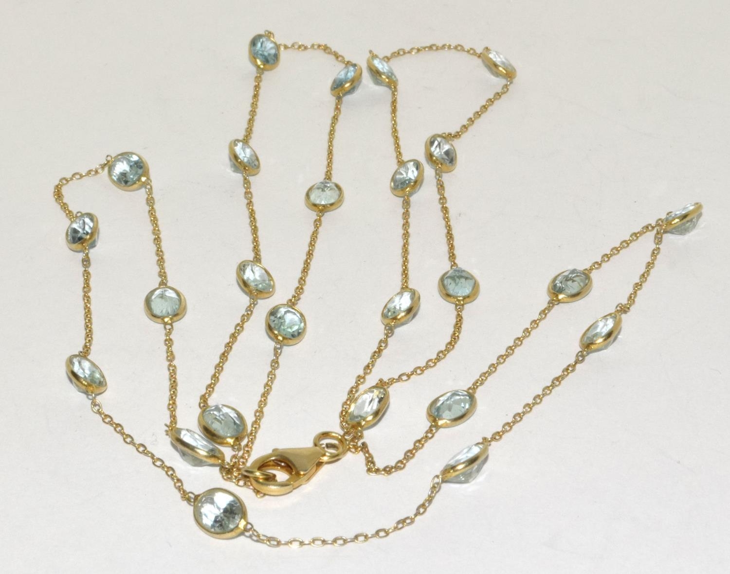 Natural Aquamarine and gold on silver long chain.