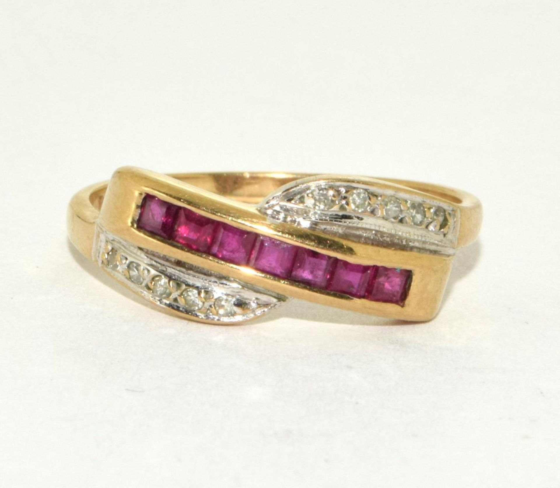 9ct gold ladies Diamond and Ruby cross over ring size R
