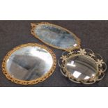 Three vintage gilded wall mirrors of varying sizes.