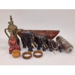 Collection of carved wooden items to include elephants together with a brass Islamic pot.