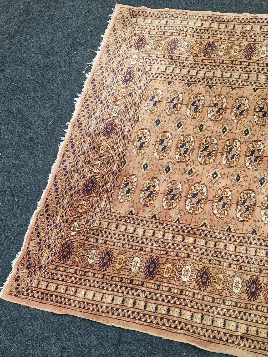 Vintage patterned carpet on brown ground 195x124cm. - Image 2 of 4