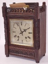 Antique Pearce & Sons oak carved chiming table clock includes key and pendulum.
