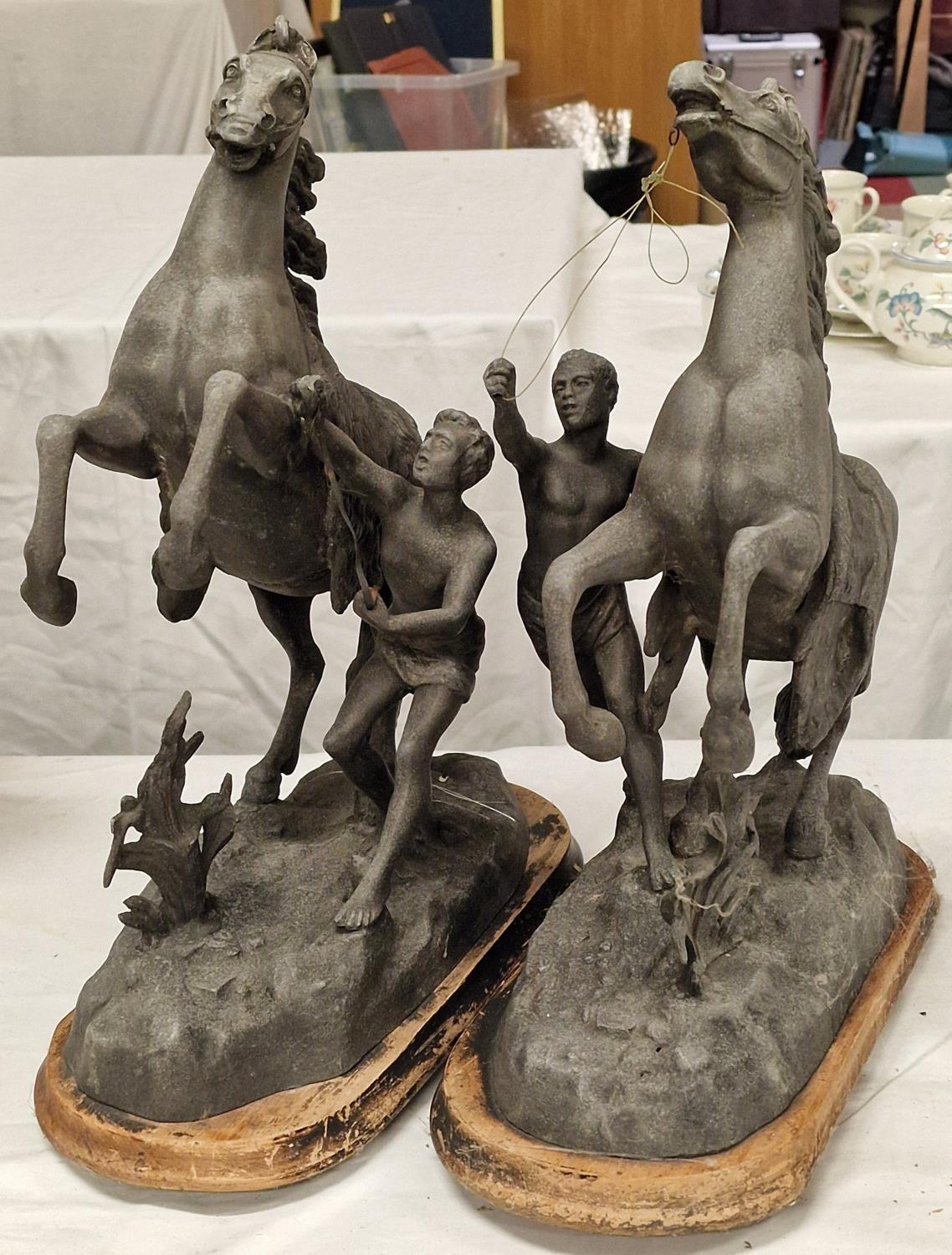 Pair of vintage spelter horse figures on wood bases.