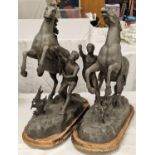 Pair of vintage spelter horse figures on wood bases.