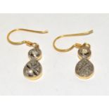 Diamond gold on silver drop earrings.