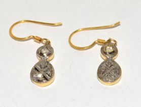 Diamond gold on silver drop earrings.