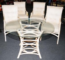Contemporary conservatory dining set to include glass topped table and four matching chairs.