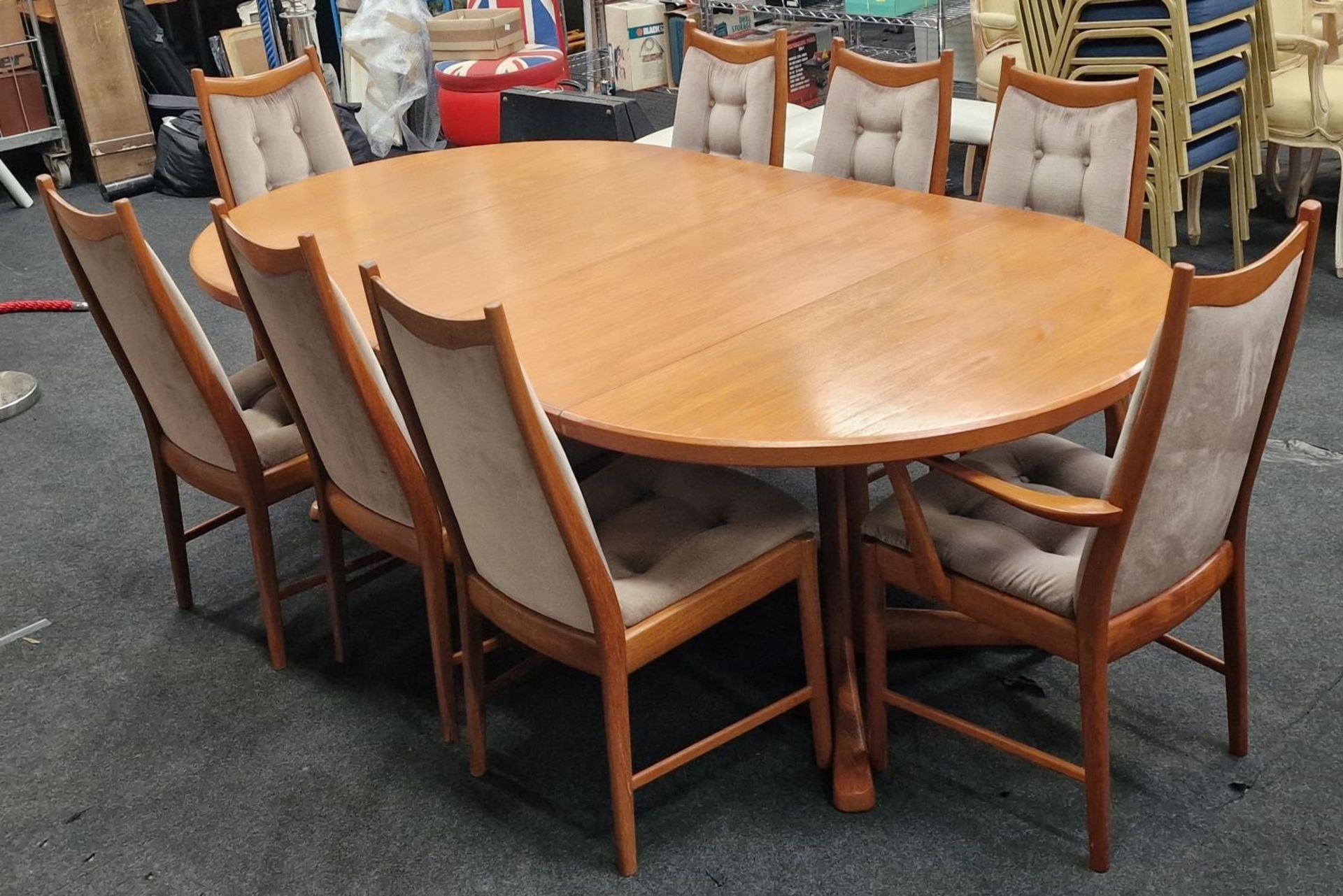 McIntosh vintage 1970's mid 20th century teak extending dining table together with eight chairs to