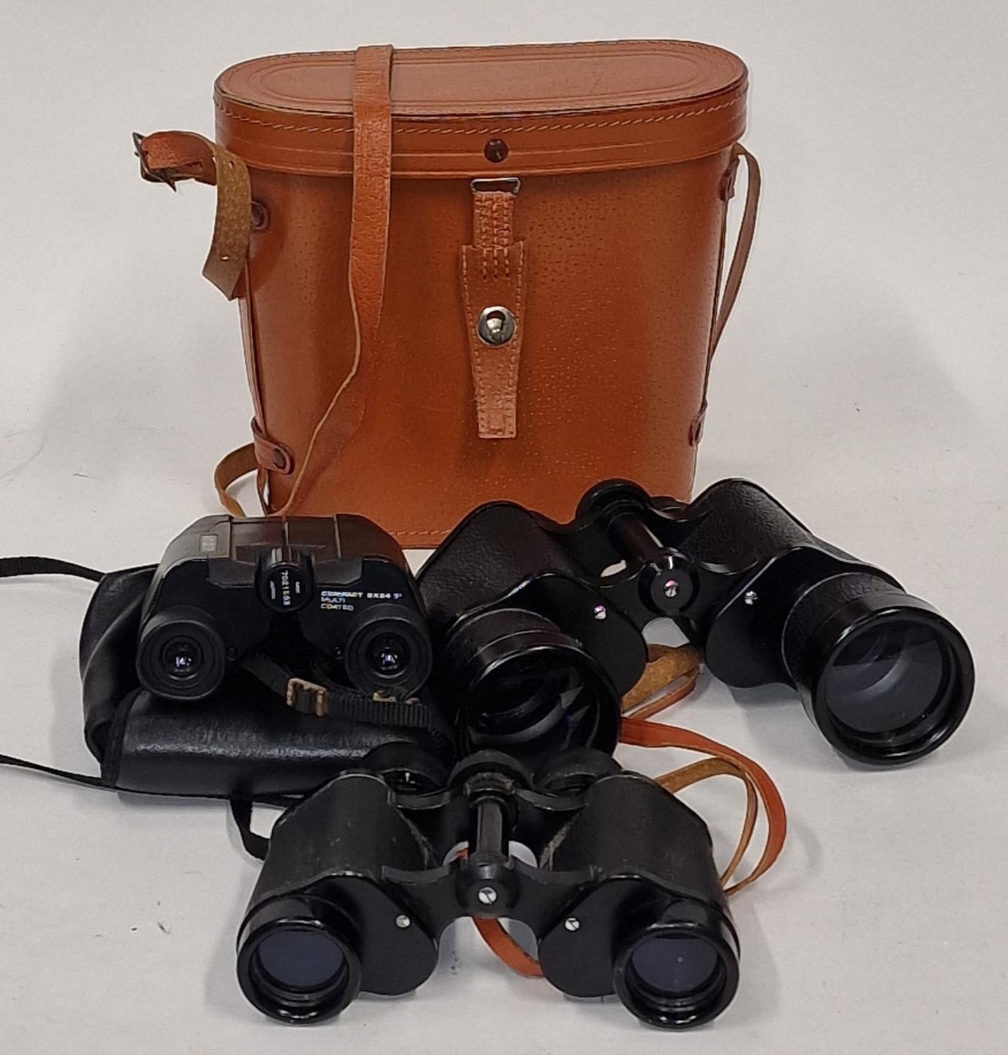 Collection of three vintage binoculars to include Minolta.
