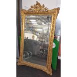 Large Gilt frame over mantle pier mirror with embossed decoration and carved top 160 x 90cm