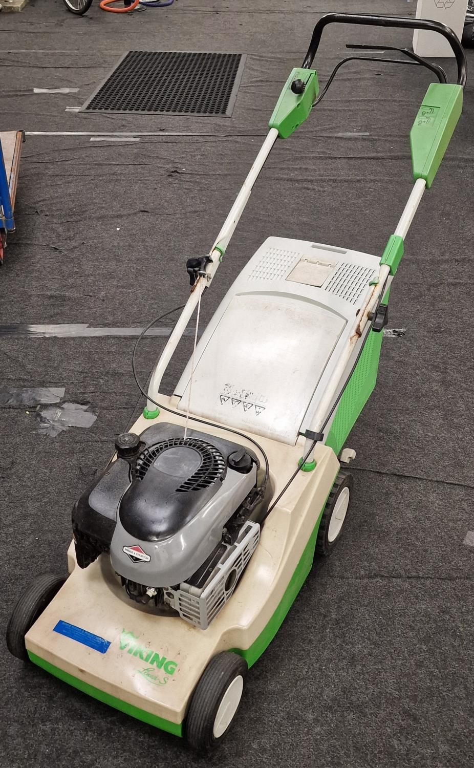 Briggs and Stratton "Viking" petrol lawn mower working at time cataloging
