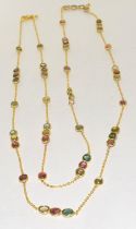 cabochon pink and green natural tourmaline gold on silver on long chain.