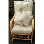 Cane conservatory chair with padded seating and two cushions to match 95x70x70cm