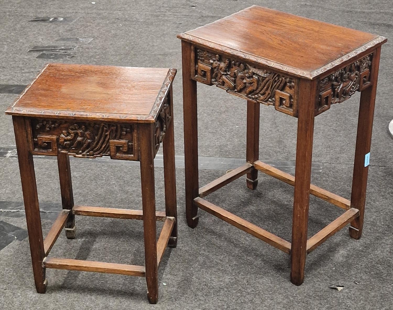 Set of two oriental mahogany carved occasional tables largest measuring 62x45x34cm.