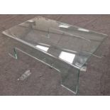 A modern glass coffee table. 35x110x65cm