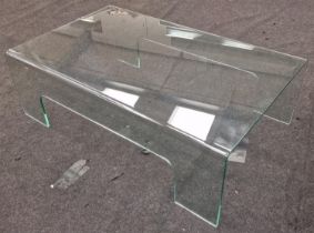 A modern glass coffee table. 35x110x65cm