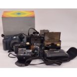 Collection of instant and brownie cameras to include Polaroid and Kodak.