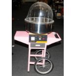 Transportable candy floss maker retail point of sale by Vevor. Spoked wheels to rear for easy