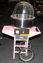 Transportable candy floss maker retail point of sale by Vevor. Spoked wheels to rear for easy