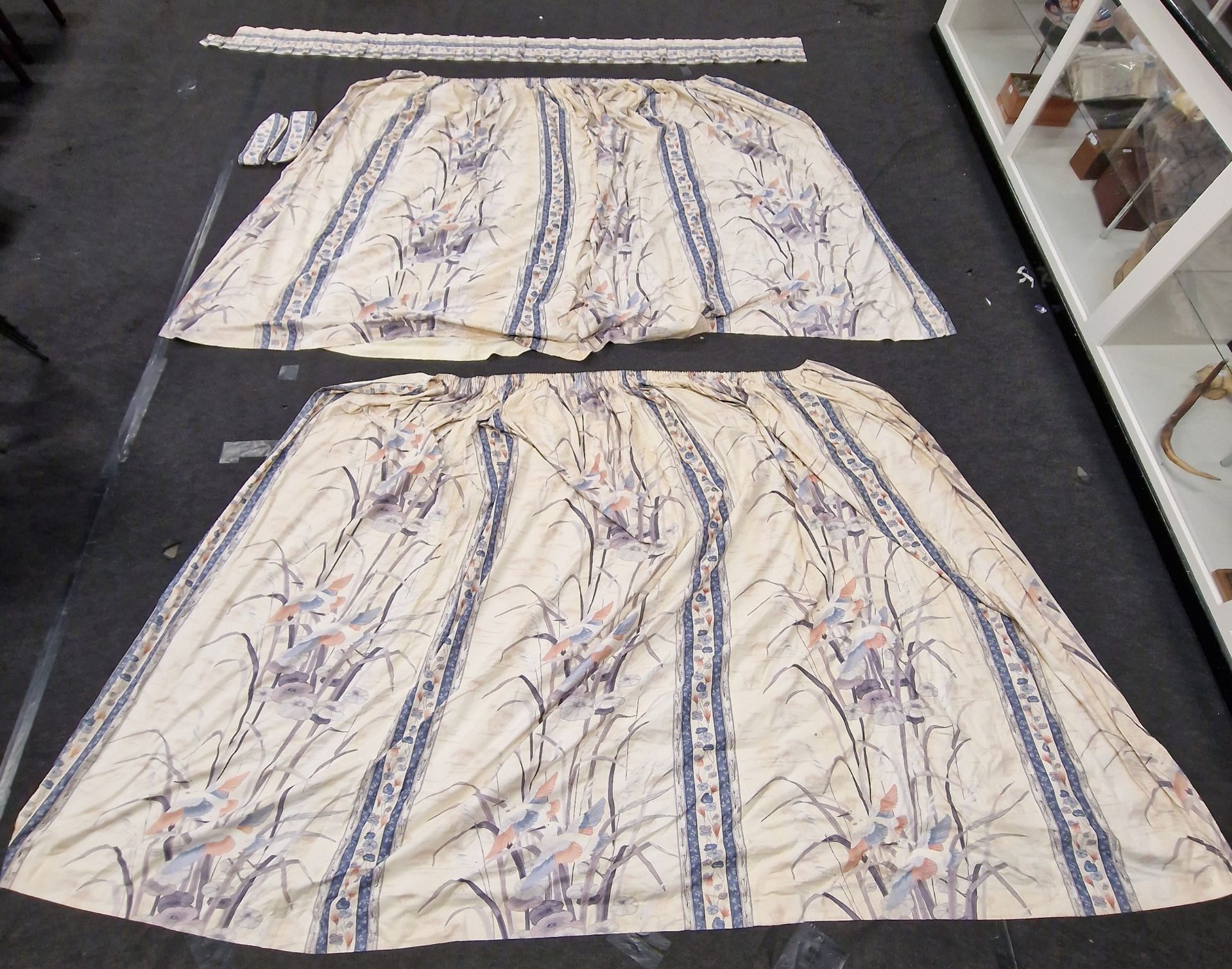 A pair of vintage patterned curtains complete with tie backs and pelmet. Each measures approx