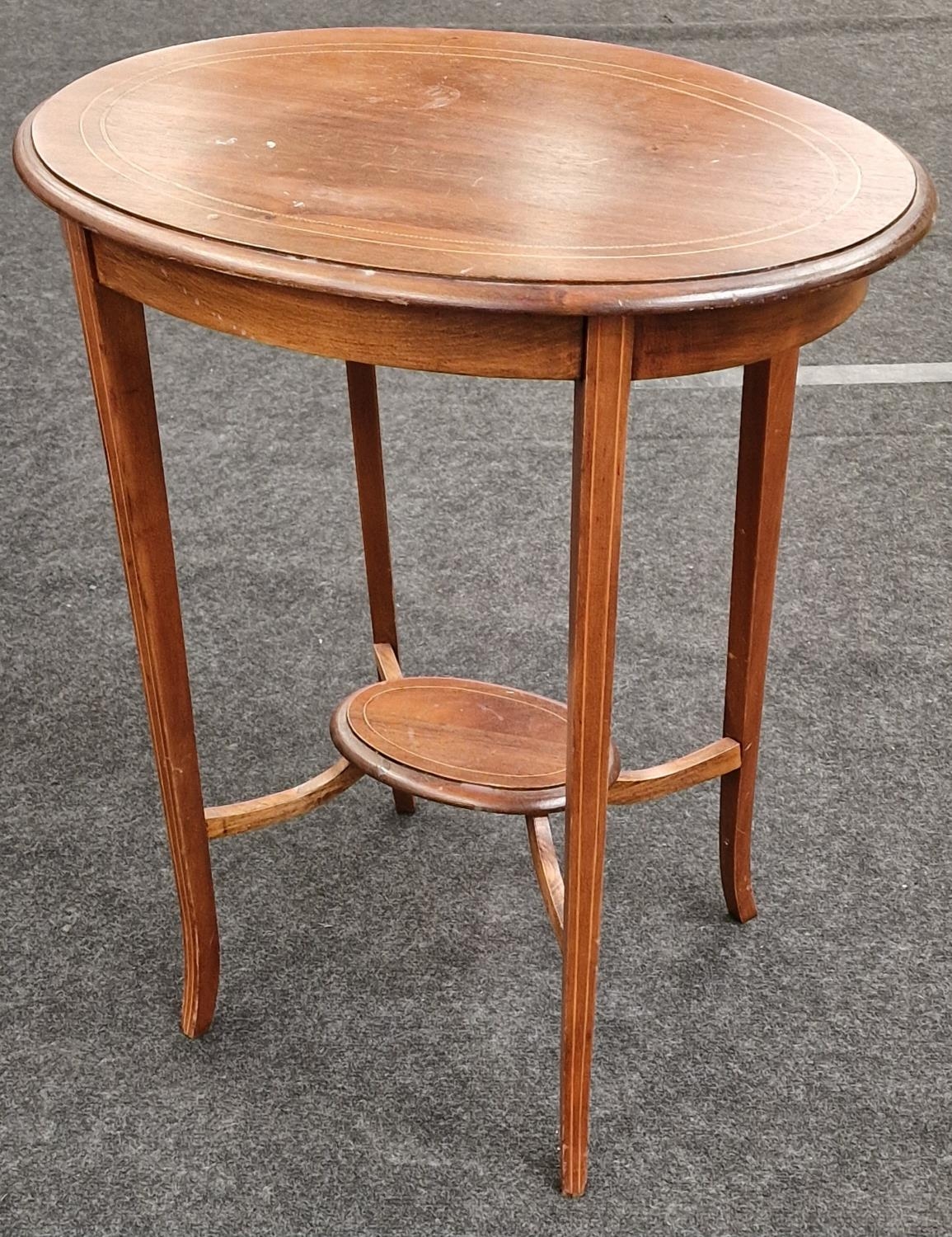 Edwardian mahogany oval inlaid lamp table with slade legs and fitted under tier 70x60x40cm