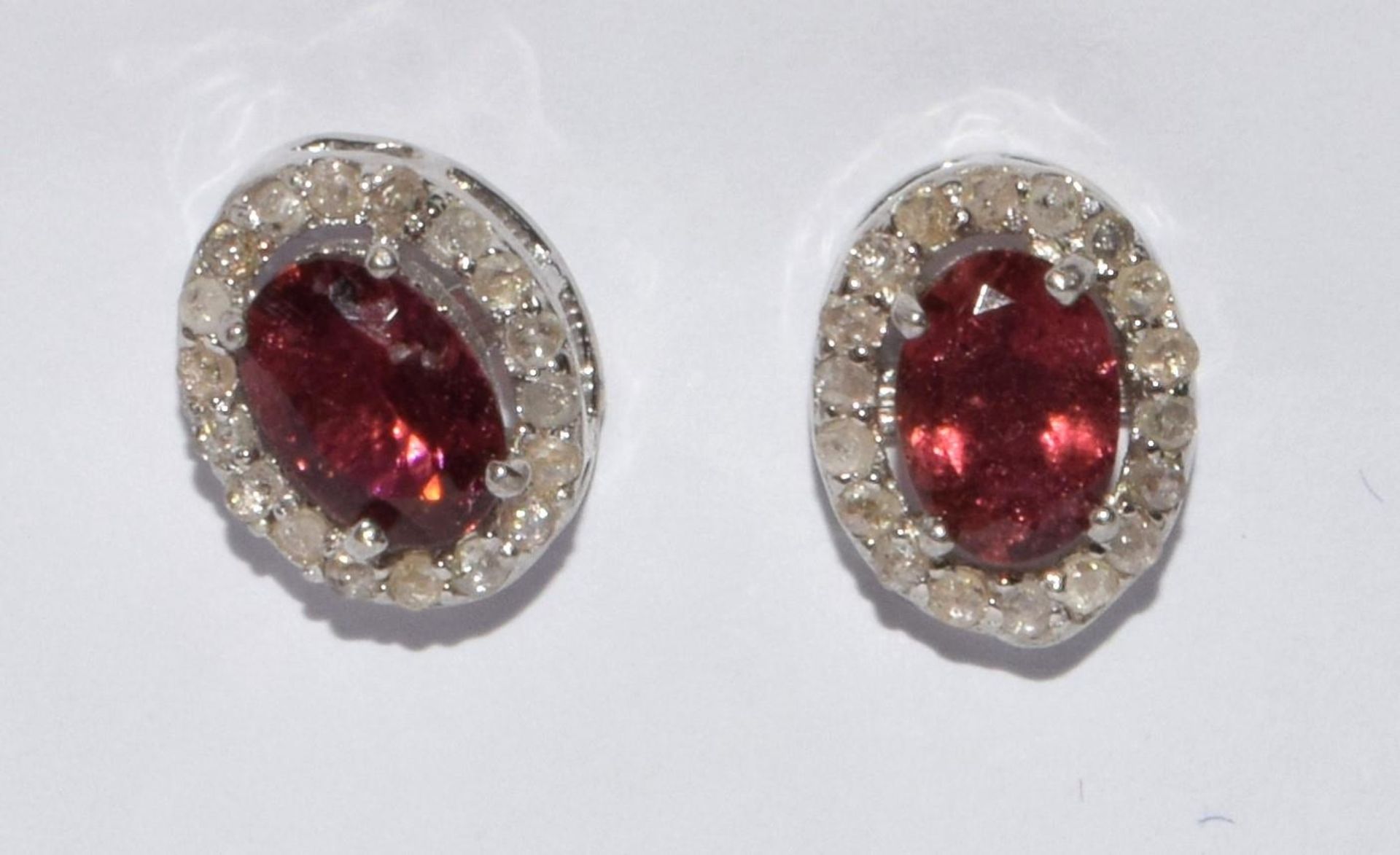 Diamond and pink tourmaline stud earrings with 18ct gold posts