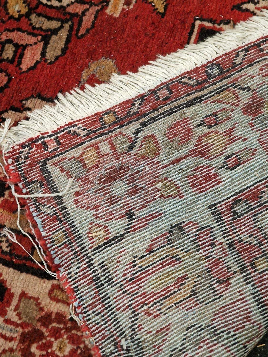 Large vintage patterned carpet on red ground 271x153cm. - Image 5 of 5