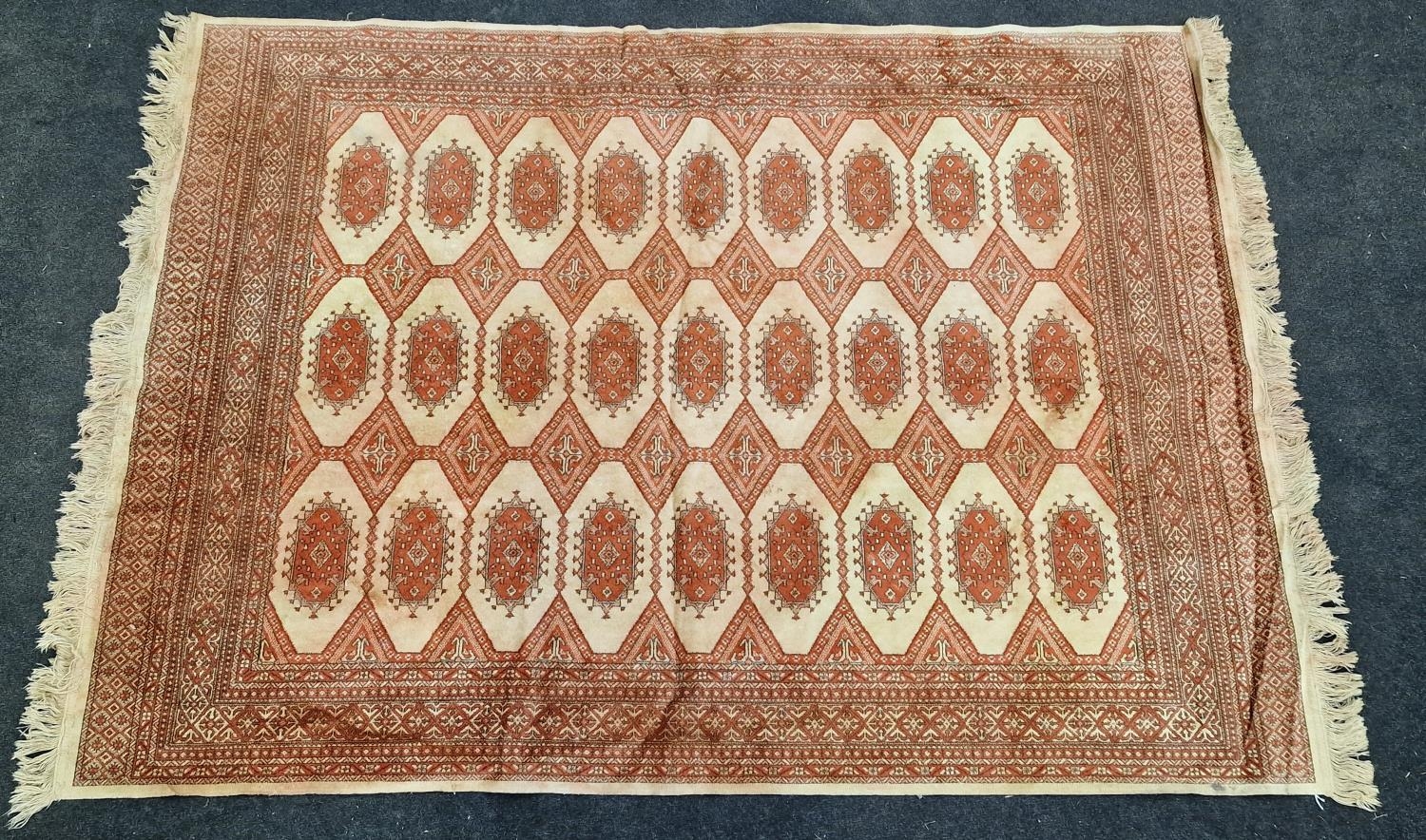 Vintage patterned carpet on beige ground 188x135cm.